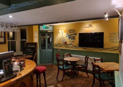 Inside The Kings Arms, a view of the seating area and bar.